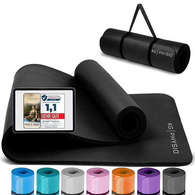 Tapis KG PHYSIO noir nervuré à demi déroulé, un carton Warentest Online 1,1 posé dessus et sept coloris alignés en dessous